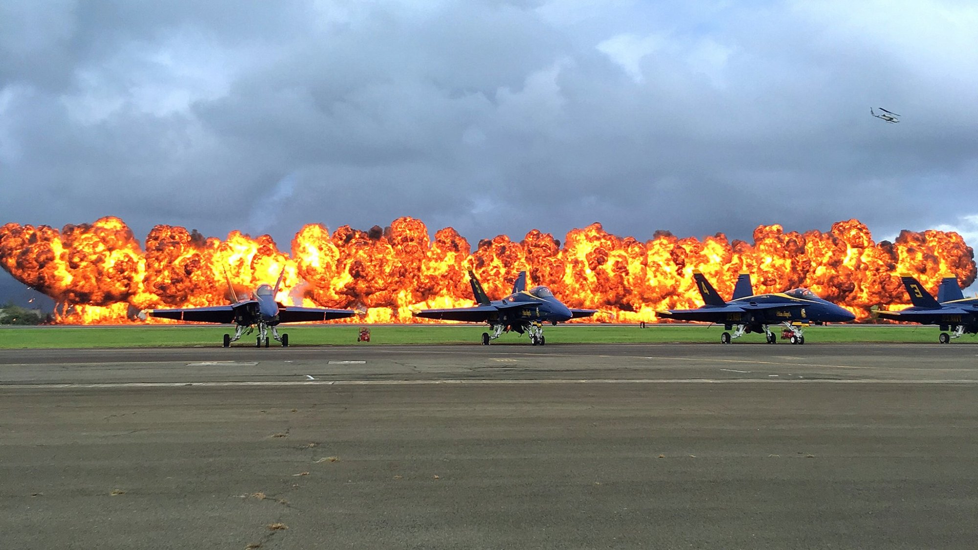 a row of parked motorcycles sitting on the side of a road