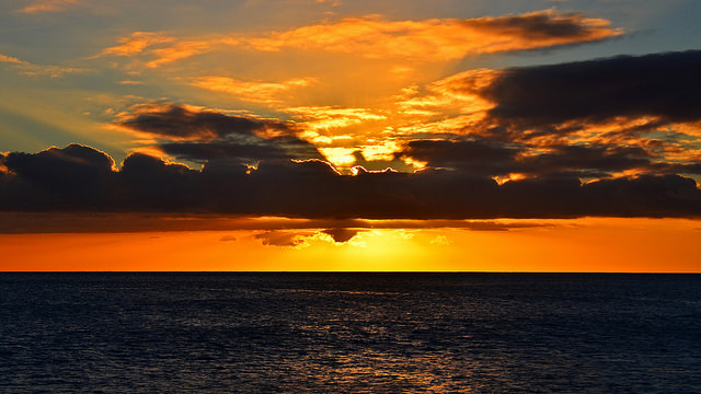 16217243430_9c95a3b4b5_z a sunset over a body of water