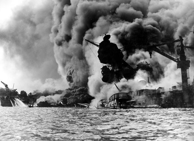 a steam train on a track with smoke coming out of it