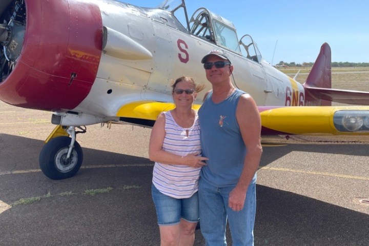 a small propeller plane sitting on top of a runway