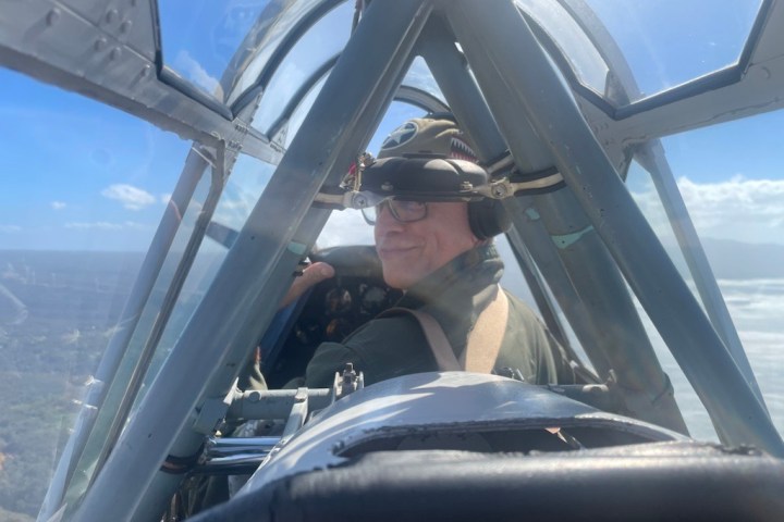 a man driving a car engine plane view of a vehicle