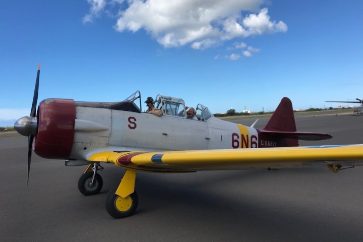 a fighter jet sitting on top of a runway