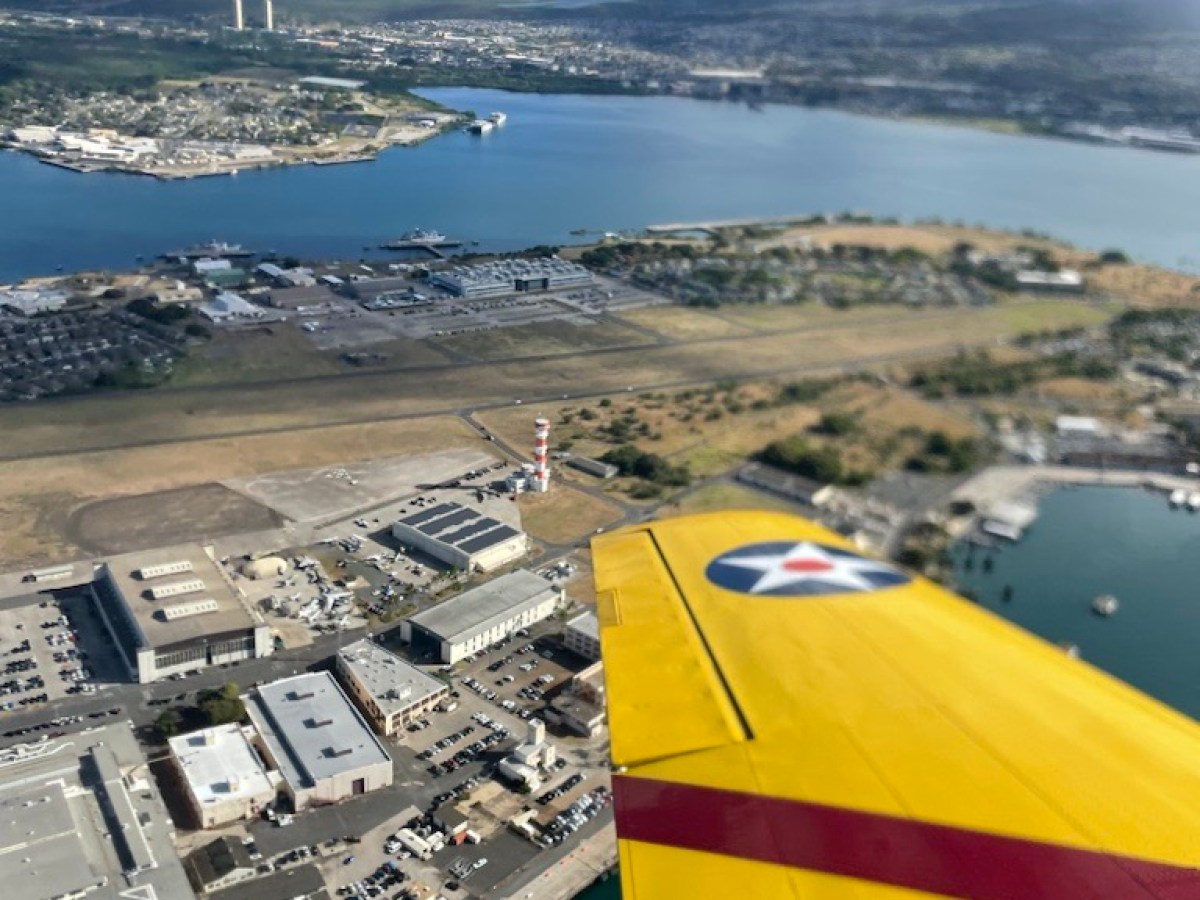 a large body of water with a city in the background