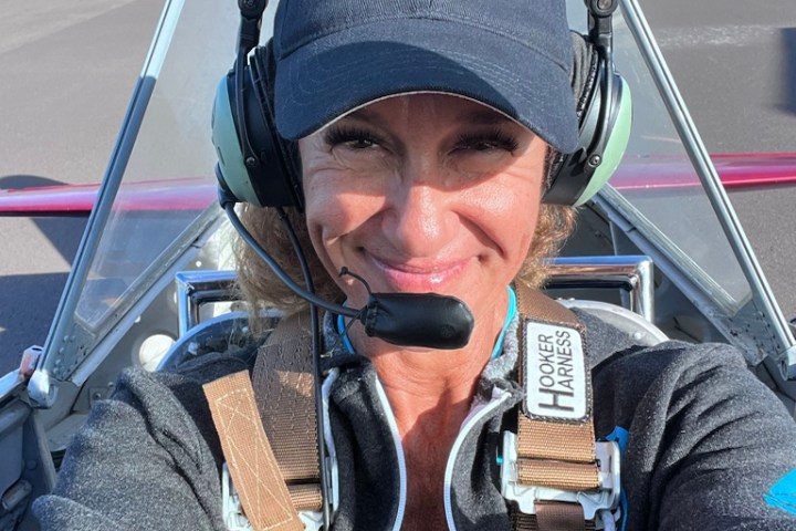 a man wearing a hat and sunglasses